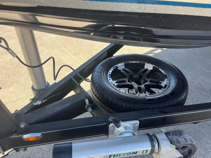 Slide: The Image of 2020 Triton 21 TRXS boat storage compartment with open lid. - 45