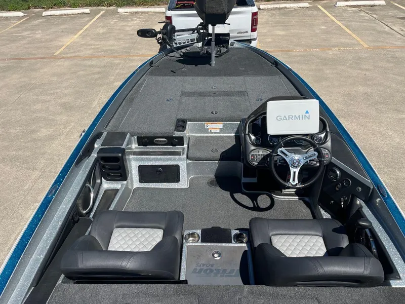 Slide: The Image of 2020 Triton 21 TRXS boat storage compartments and deck. - 46