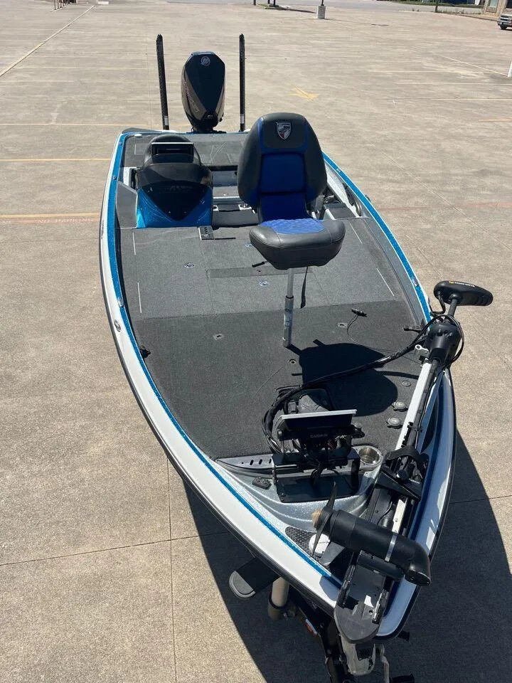 Slide: The Image of 2020 Triton 21 TRXS boat storage compartment with open lid. - 47