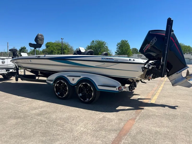 Slide: The Image of Garmin display with three electronic devices, showcasing navigation and mapping features. - 6