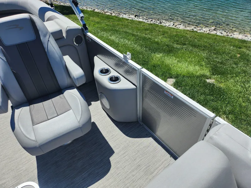 Slide: The Image of Interior of a 2020 Bennington SX 22 SSRCX pontoon boat with gray seating. - 11