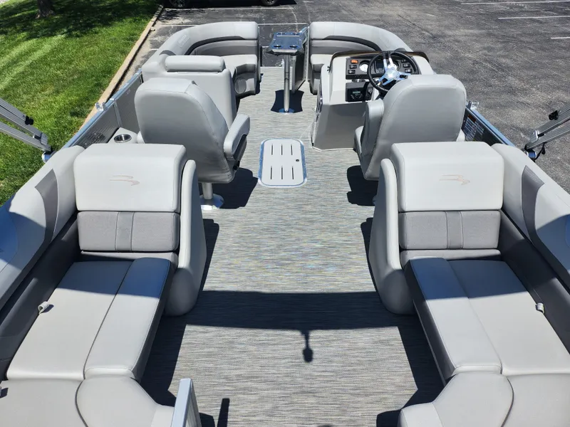 Slide: The Image of 2020 Bennington SX 22 SSRCX pontoon boat interior with spacious seating and modern helm. - 15