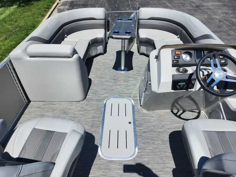 Slide: The Image of 2020 Bennington SX 22 SSRCX pontoon boat interior with gray seating and steering console. - 16