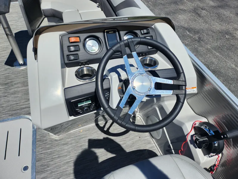 Slide: The Image of 2020 Bennington SX 22 SSRCX boat steering console with gauges and controls. - 17