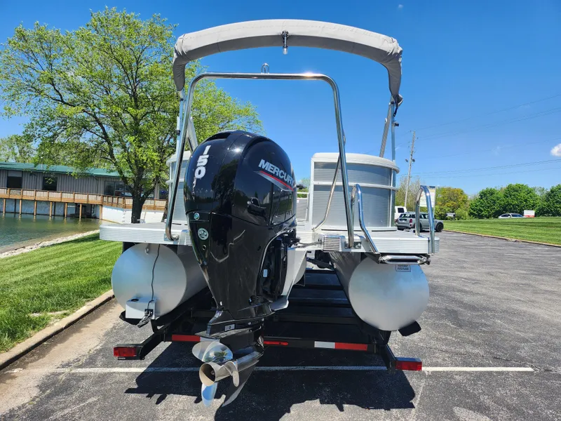 Slide: The Image of 2020 Bennington SX 22 SSRCX pontoon boat with Mercury outboard motor. - 2