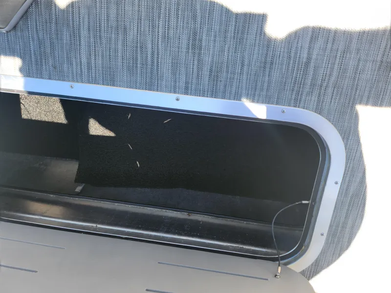 Slide: The Image of Open storage compartment on a 2020 Bennington SX 22 SSRCX pontoon boat. - 20