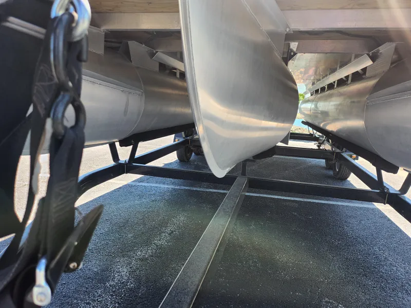 Slide: The Image of Underneath view of a 2020 Bennington SX 22 SSRCX pontoon boat on a trailer. - 7