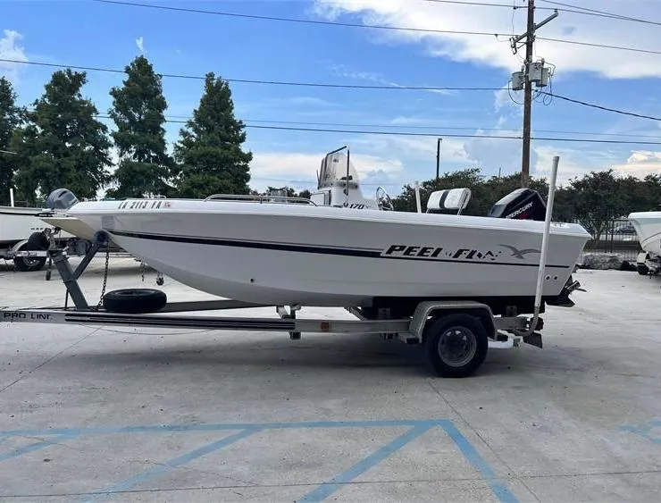 Slide: The Image of 1999 Pro-Line 170CC boat on trailer in parking lot. - 5