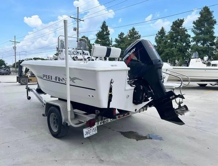 Slide: The Image of 1999 Pro-Line 170CC boat on trailer with Mercury outboard motor. - 6