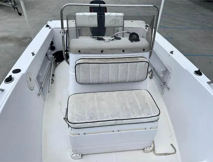 Slide: The Image of 1999 Pro-Line 170CC boat interior with seating and console. - 7
