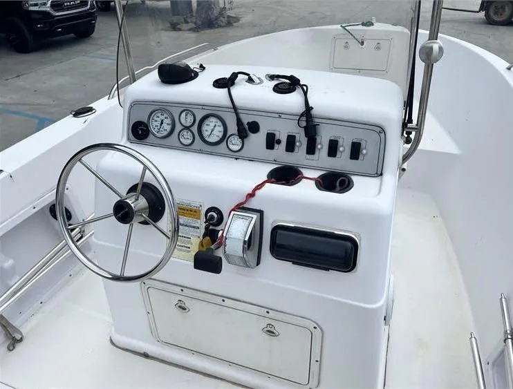 Slide: The Image of 1999 Pro-Line 170CC boat console with steering wheel and gauges. - 8