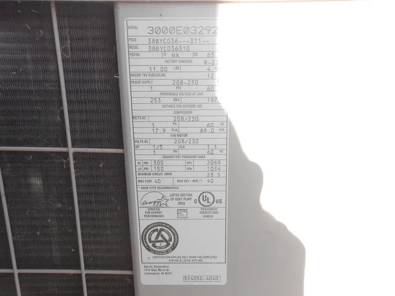 Slide: The Image of 2001 Stardust Cruisers Houseboat air conditioning unit label with specifications and certifications. - 20