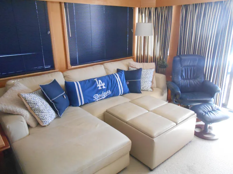 Slide: The Image of Luxurious 2001 Stardust Cruisers houseboat interior with beige sectional sofa and blue accents. - 5