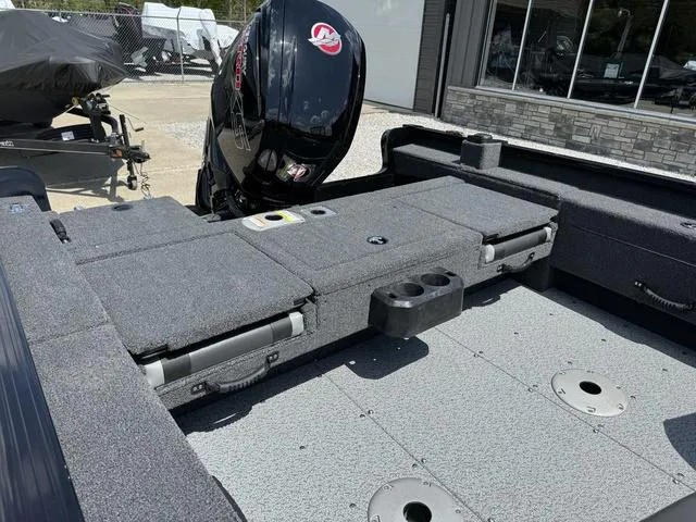 Slide: The Image of 2024 Lund 1775 Adventure Sport boat interior with Mercury outboard motor. - 5