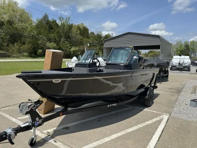 Slide: The Image of 2024 Lund 1775 Adventure Sport boat on trailer in outdoor lot. - 9