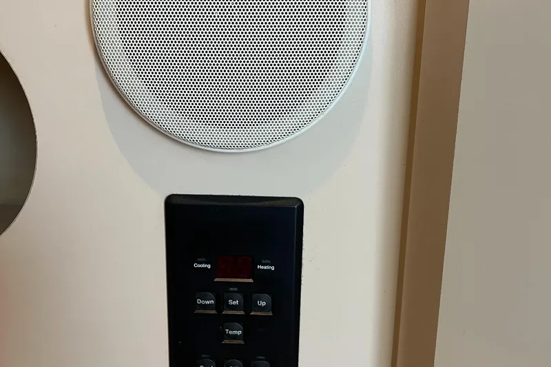 Slide: The Image of Thermostat and speaker on 2000 Cruisers Yachts 3075 Express. - 15