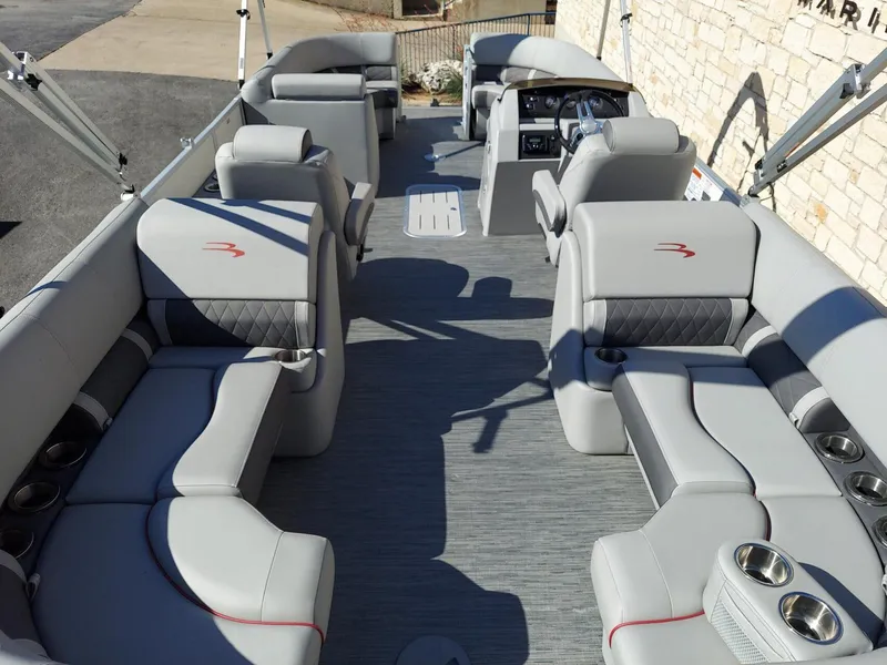 Slide: The Image of 2023 Bennington 23L pontoon boat interior with luxurious seating and modern design. - 3