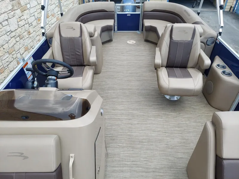 Slide: The Image of 2023 Bennington 22S boat interior with plush seating and modern steering console. - 3
