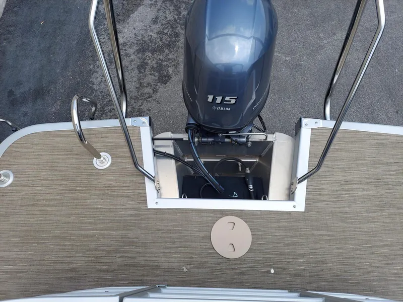 Slide: The Image of 2023 Bennington 22S boat with Yamaha 115 engine, rear deck view. - 7