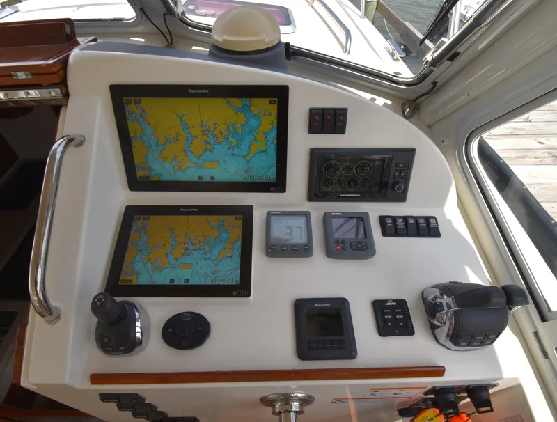 Slide: The Image of Control panel of a 2011 MJM 40z Downeast boat with navigation screens. - 17