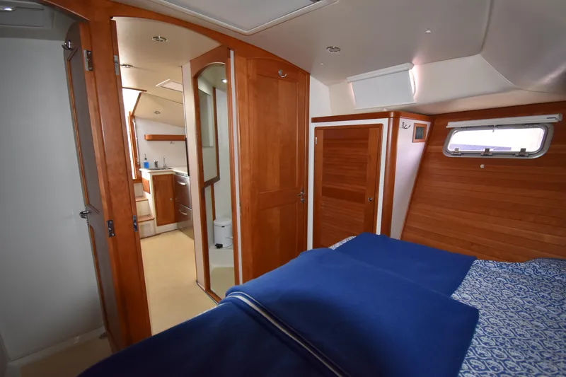 Slide: The Image of 2011 MJM 40z Downeast yacht interior with wooden finishes and cozy bedroom. - 25
