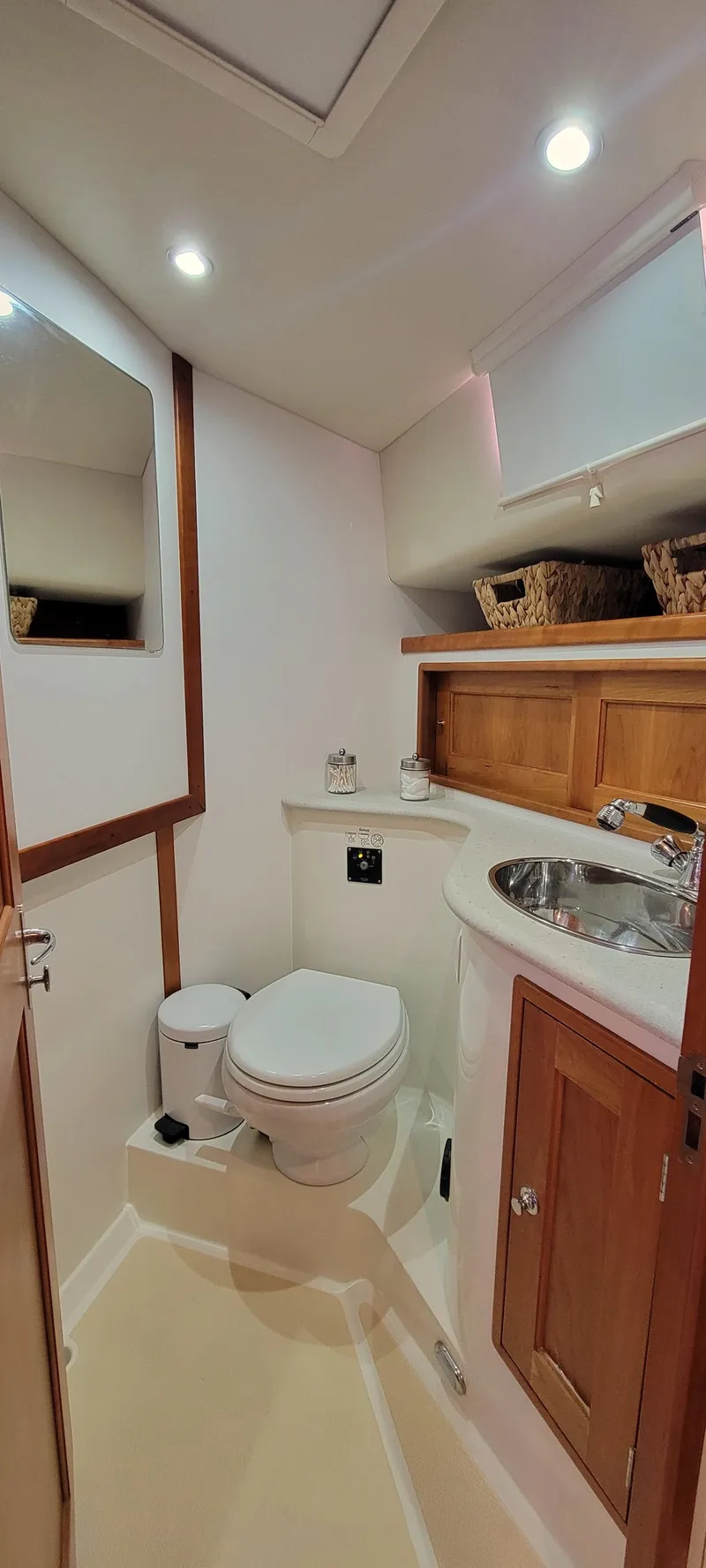 Slide: The Image of 2011 MJM 40z Downeast yacht bathroom with modern fixtures and wooden cabinetry. - 26