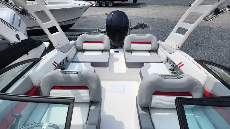 Slide: The Image of 2025 Regal LX2 boat interior with sleek seating and modern design. - 13