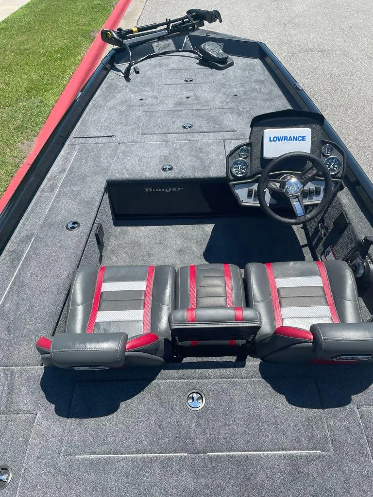 Slide: The Image of 2024 Ranger RT178C fishing boat interior with Lowrance electronics and three seats. - 3