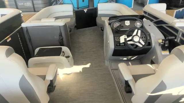 Slide: The Image of 2024 MONACO Monaco 235 RL boat interior with modern seating and steering console. - 4