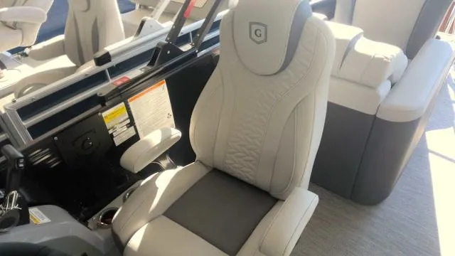 Slide: The Image of 2024 MONACO Monaco 235 RL boat interior with luxurious seating. - 6