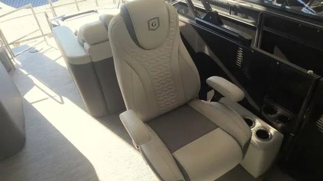 Slide: The Image of Luxurious captain's chair in the 2024 MONACO Monaco 235 RL pontoon boat. - 7