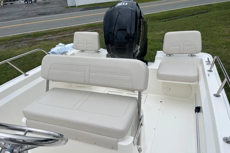Slide: The Image of 2026 Boston Whaler 170 Montauk boat interior with seating and outboard motor. - 10