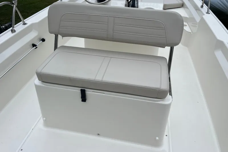 Slide: The Image of 2026 Boston Whaler 170 Montauk boat seat, featuring sleek white upholstery. - 14