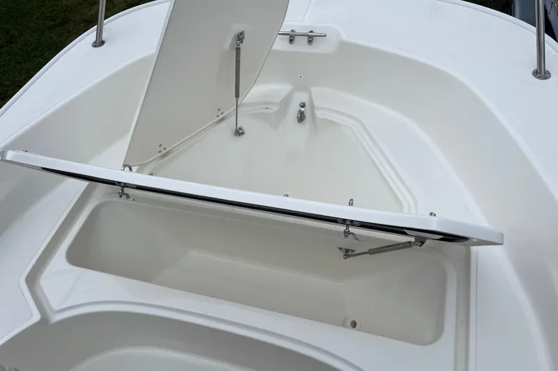 Slide: The Image of Open storage compartment on 2026 Boston Whaler 170 Montauk boat. - 19
