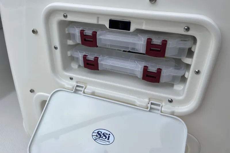 Slide: The Image of Storage compartment on 2026 Boston Whaler 170 Montauk boat with tackle boxes. - 20