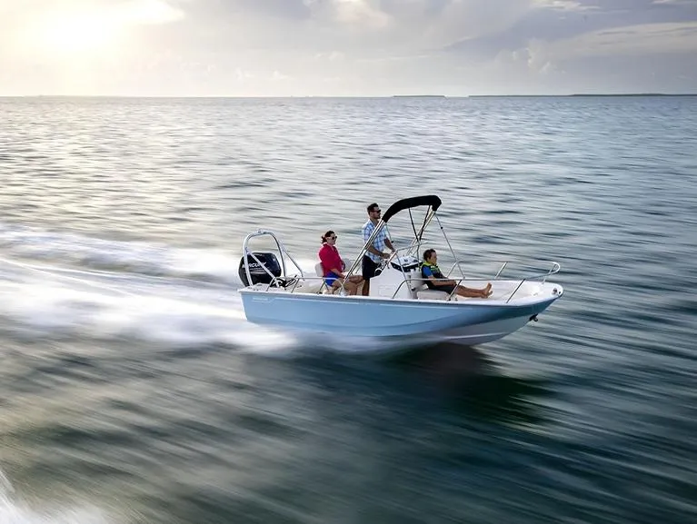 Slide: The Image of 2026 Boston Whaler 170 Montauk interior with Igloo cooler and cushioned seating. - 9