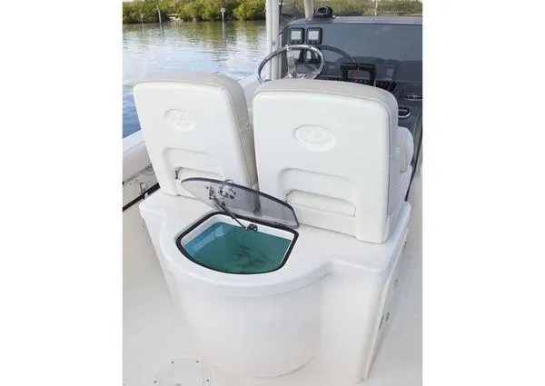 Slide: The Image of 2013 Pursuit C 260 Center Console boat interior with livewell and dual seats. - 26