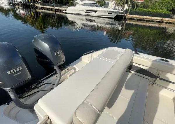 Slide: The Image of 2013 Pursuit C 260 Center Console boat with twin Yamaha 150 engines docked. - 30