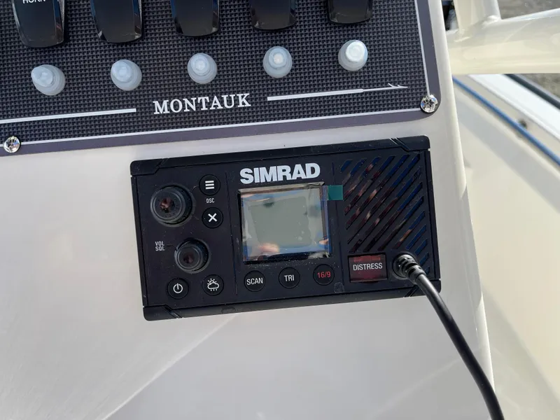 Slide: The Image of Control panel of 2025 Boston Whaler 190 Montauk with Simrad marine electronics. - 13