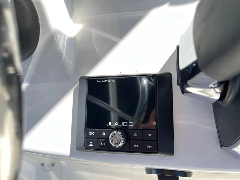 Slide: The Image of JL Audio system on 2025 Boston Whaler 190 Montauk boat dashboard. - 14