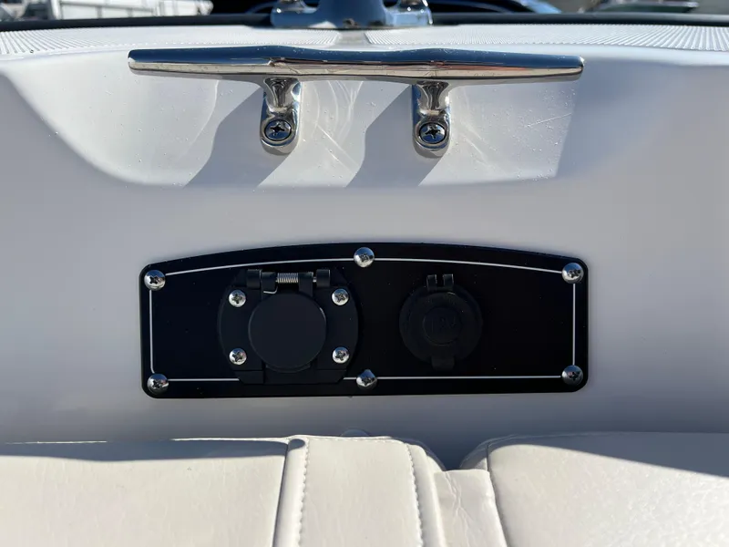 Slide: The Image of 2025 Boston Whaler 190 Montauk boat dashboard with dual socket panel and cleat. - 19