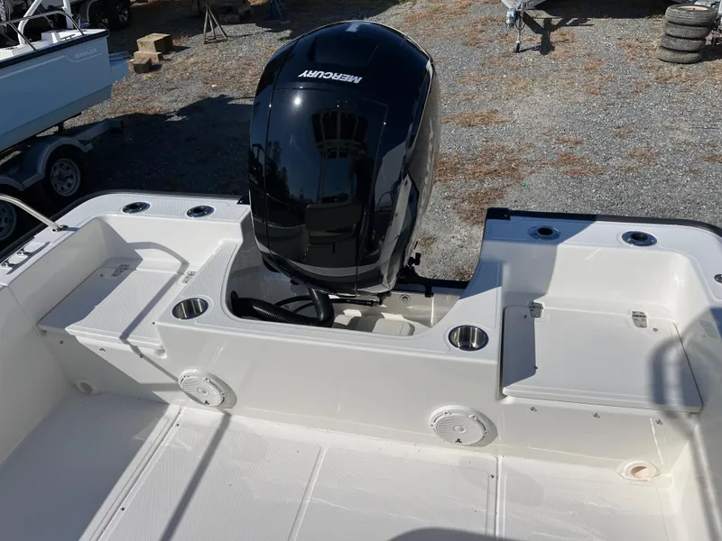 Slide: The Image of 2025 Boston Whaler 190 Montauk boat with Mercury engine, rear deck view. - 21