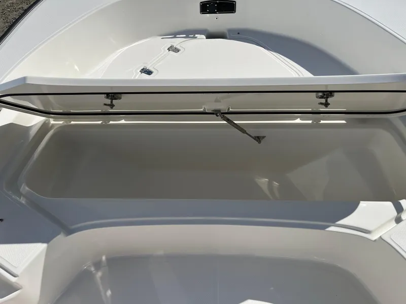 Slide: The Image of 2025 Boston Whaler 190 Montauk boat storage compartment, open and empty. - 23