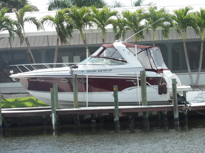 Slide: The Image of 2008 Formula 31 Performance Cruiser docked near palm trees. - 1