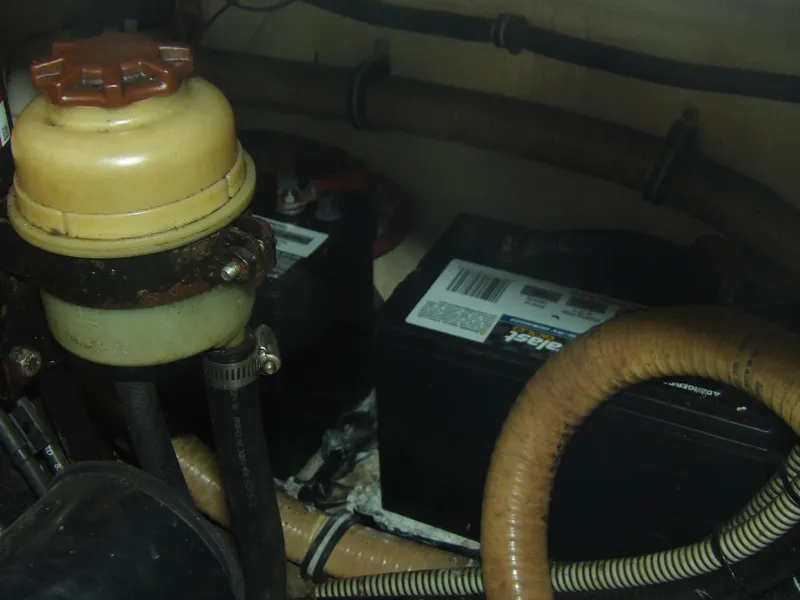 Slide: The Image of Engine compartment of a 2008 Formula 31 Performance Cruiser with batteries and hoses. - 23