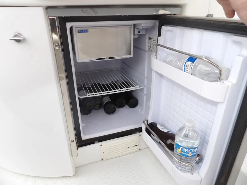Slide: The Image of Open mini fridge on 2008 Formula 31 Performance Cruiser with drinks inside. - 27