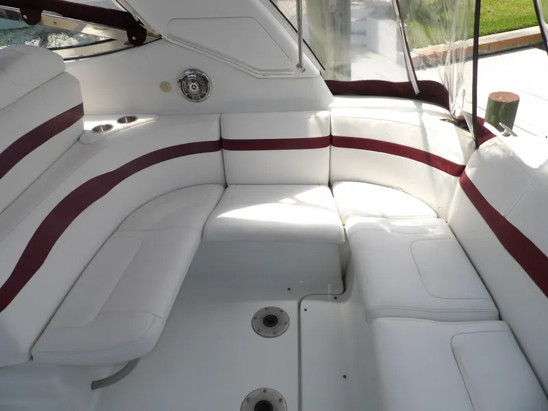 Slide: The Image of 2008 Formula 31 Performance Cruiser interior seating area with white and maroon upholstery. - 31