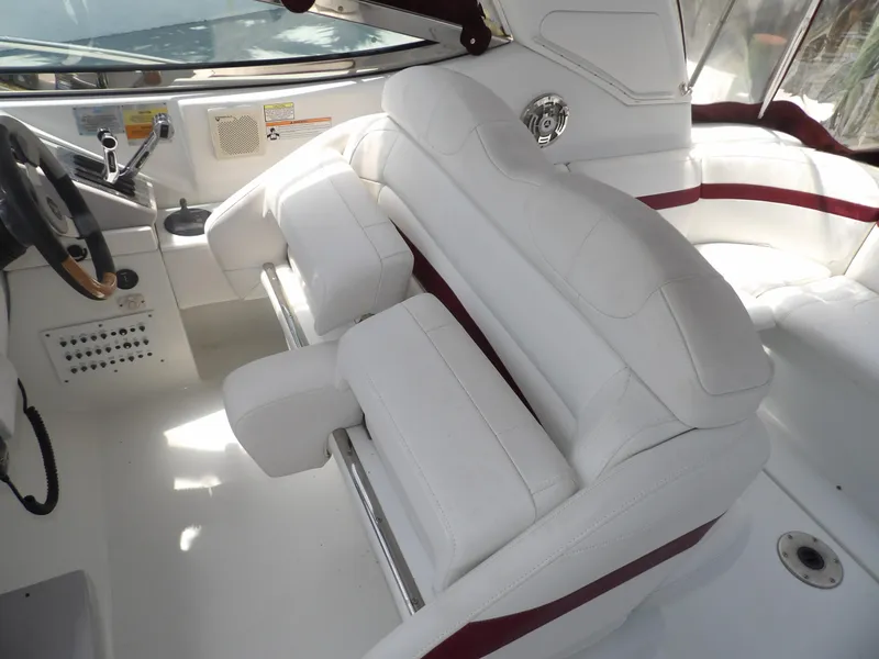 Slide: The Image of 2008 Formula 31 Performance Cruiser cockpit with white seating and steering wheel. - 34