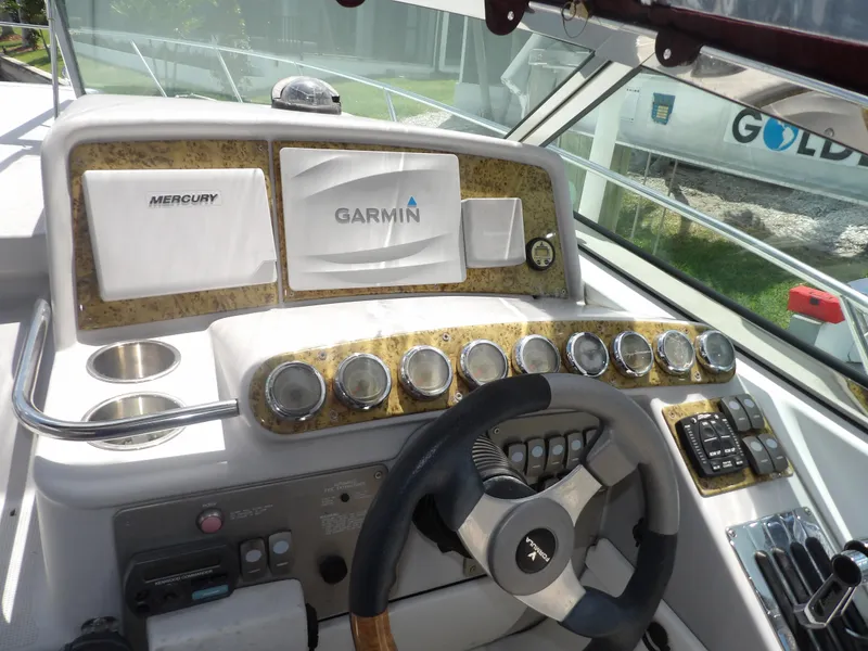 Slide: The Image of 2008 Formula 31 Performance Cruiser dashboard with Garmin and Mercury displays. - 35