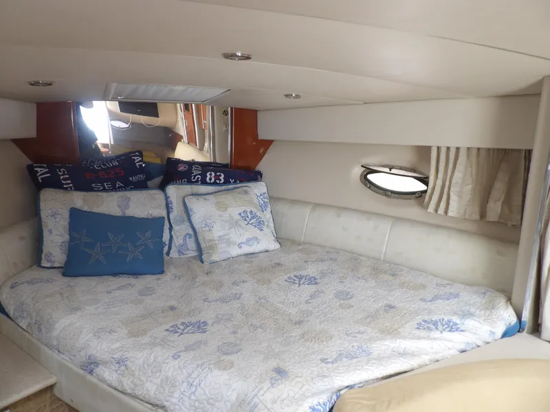 Slide: The Image of 2008 Formula 31 Performance Cruiser cabin with cozy bed and nautical-themed decor. - 42